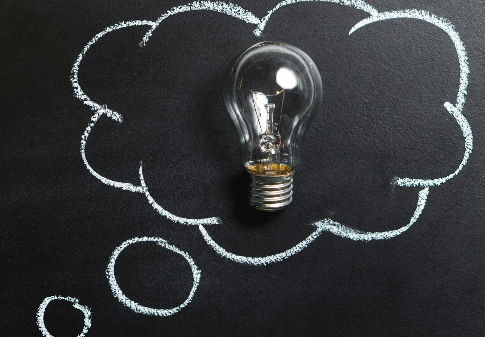 light bulb with a question bubble around it